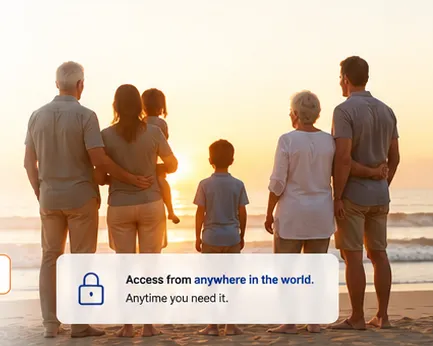 A family standing together at the beach at sunset